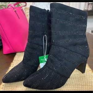 Add shimmer to every movement with the Victoria bootie from Impo.